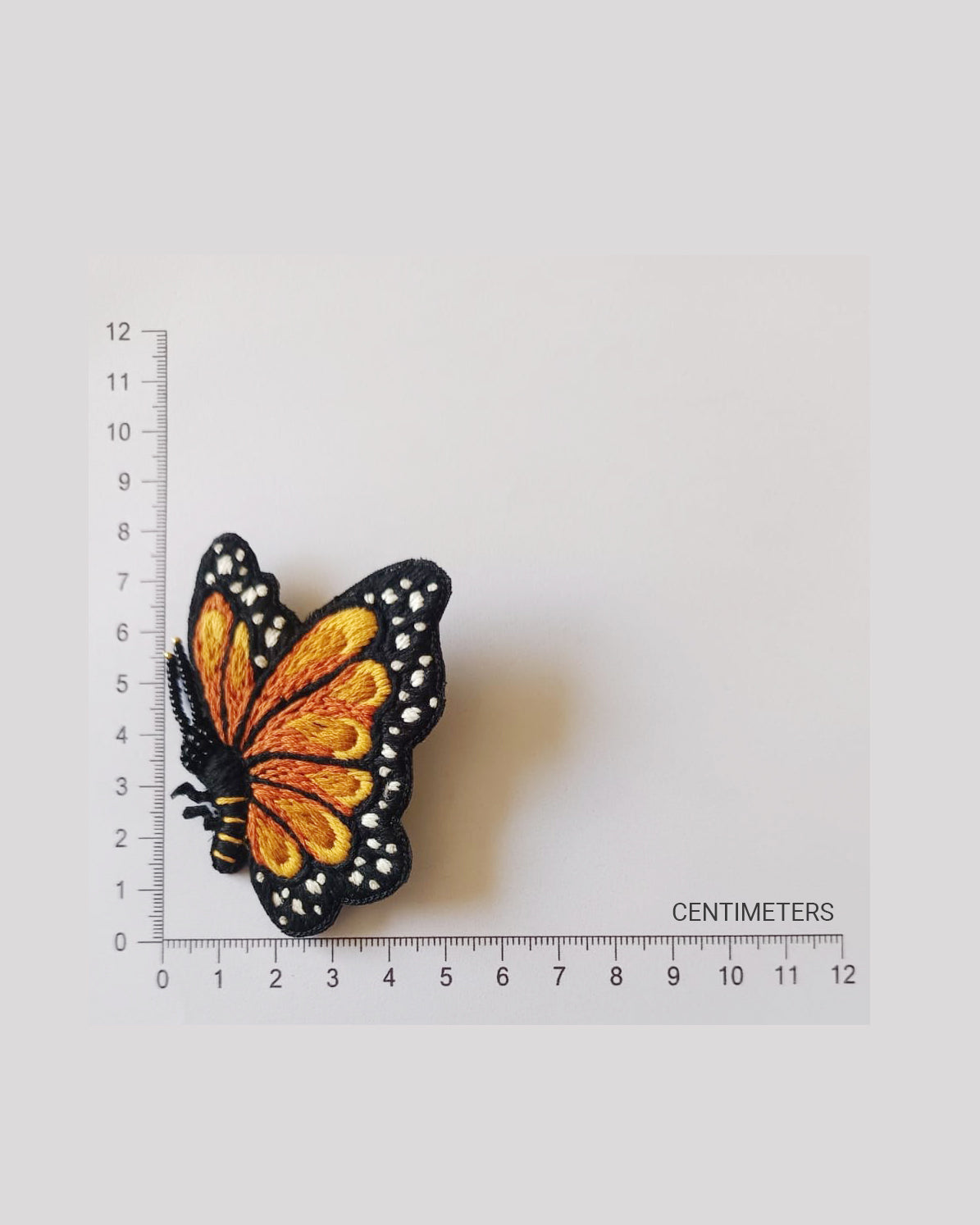 Bead-embroidered brooches