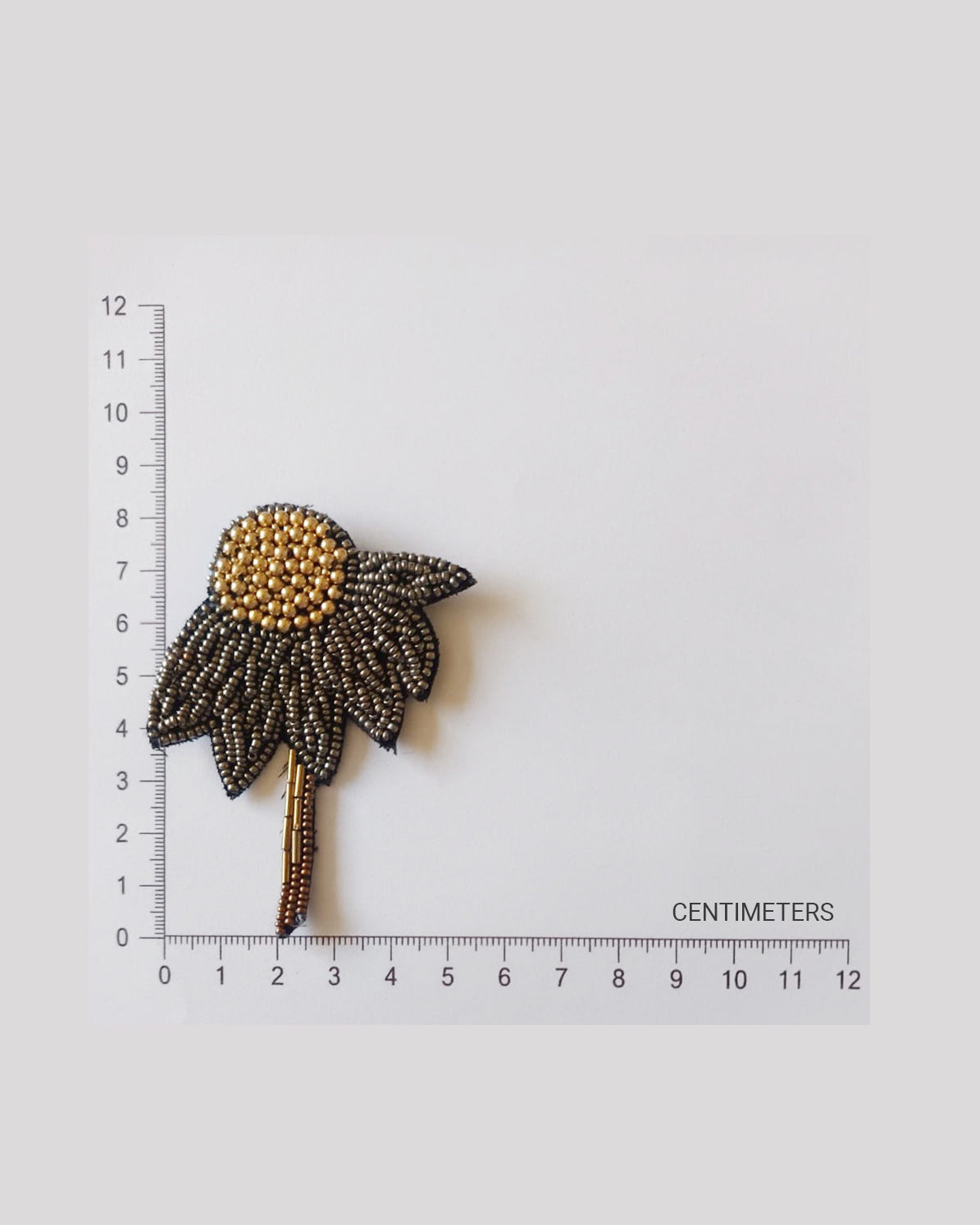 Bead-embroidered brooches